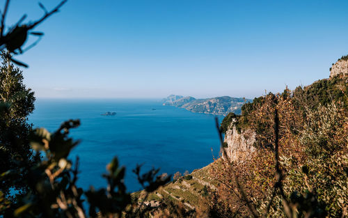 Scenic view of sea against clear blue sky