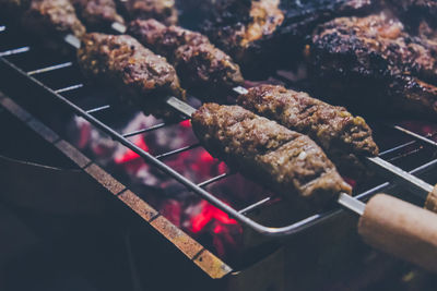 High angle view of meat on barbecue grill