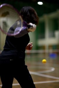 Woman playing tennis on court