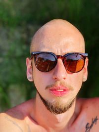 Portrait of young man wearing sunglasses