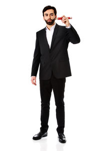 Portrait of young man standing against white background