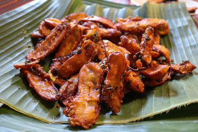 Close-up of food served in leaf on table