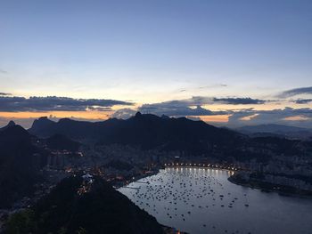 Scenic view of mountains against sky at sunset