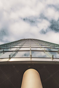 Low section of woman on roof against sky