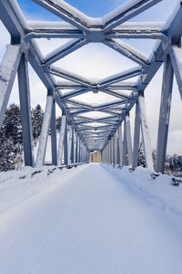 Bridge over snow covered land