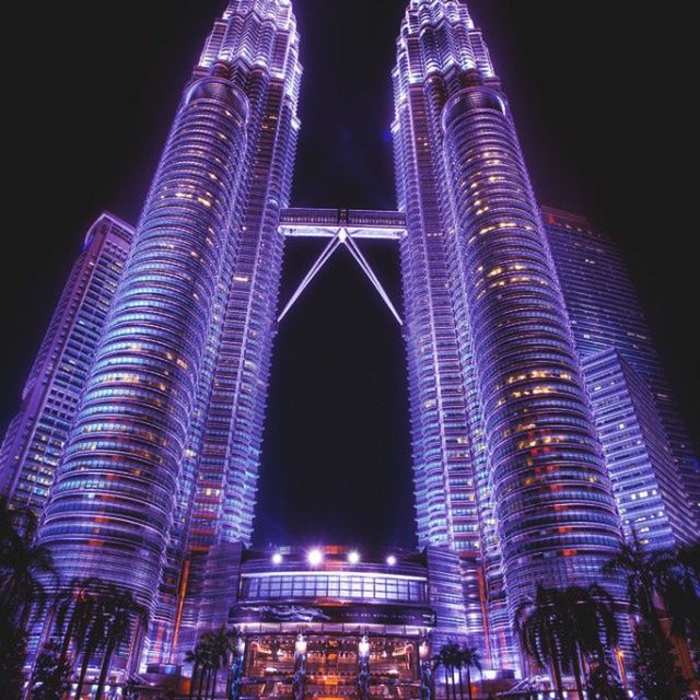 night, illuminated, architecture, built structure, building exterior, city, skyscraper, modern, tall - high, low angle view, tower, travel destinations, capital cities, famous place, office building, international landmark, tourism, travel, city life, cityscape