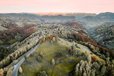 Aerial view of road, hills and mountain in autumn