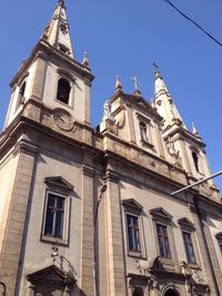 Low angle view of historic building against clear blue sky