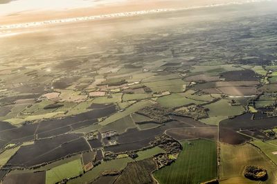Aerial view of agricultural field against sky