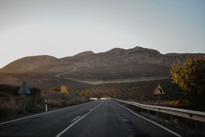 Empty road against clear sky