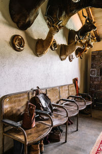 Chairs on table against wall at home