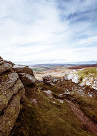 Rocks on land against sky