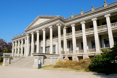 Low angle view of building against blue sky