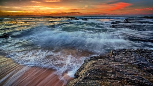 Scenic view of sea at sunset