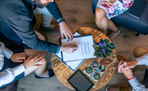 High angle view of business people sitting in meeting