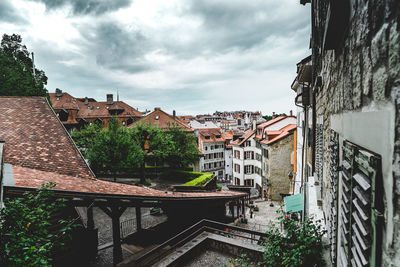 Houses in town against sky