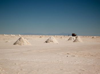 Scenic view of desert against clear sky