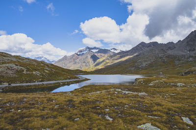 Scenic view of lake and mountains against sky