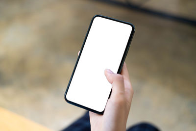 Close-up of hand using mobile phone