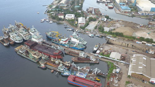 High angle view of boats moored at harbor