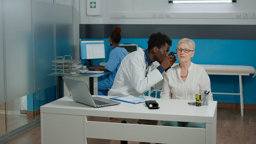 Doctor examining patient at hospital