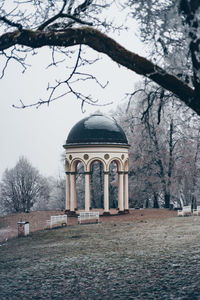 Exterior of building by trees against sky