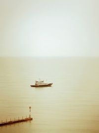 Boat on sea against clear sky