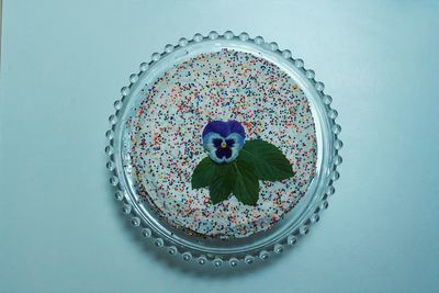 High angle view of multi colored food in bowl on table