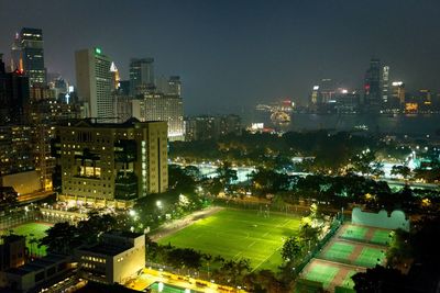 Aerial view of city lit up at night