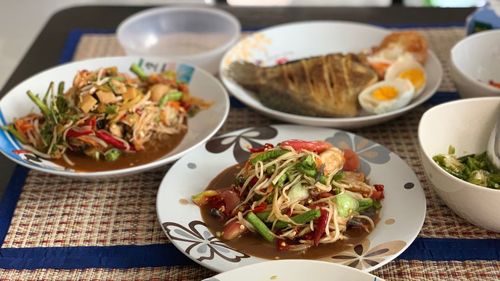 High angle view of food in plates on table