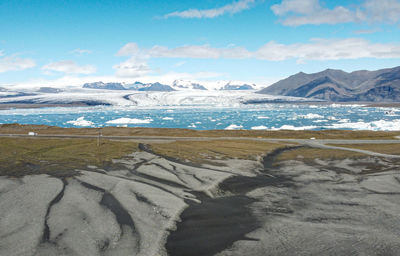 Scenic view of snowcapped mountains against sky