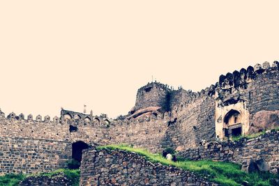 Low angle view of old ruins against clear sky