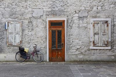 Bicycle on wall of building