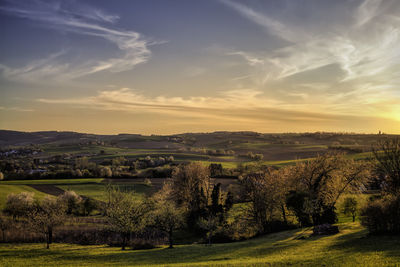 Scenic view of landscape against sky during sunset