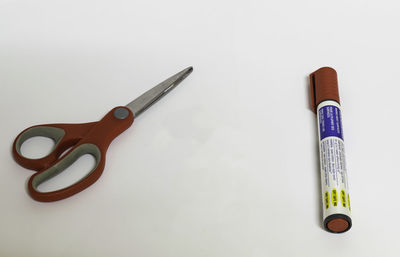 Close-up of objects on table against white background