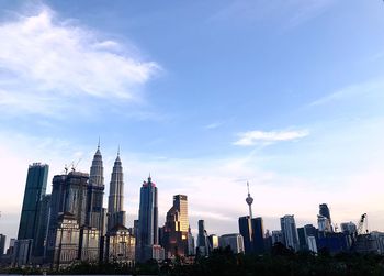 Panoramic view of buildings in city against sky