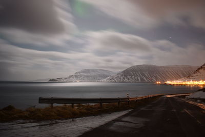 Road by sea against sky