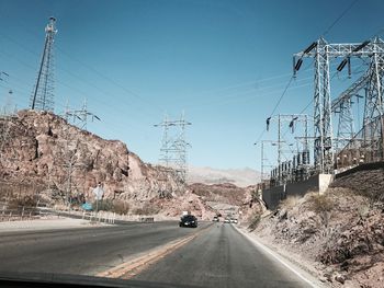 Overhead cable car against sky