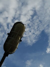 Low angle view of telephone pole against sky