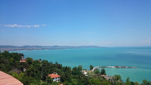 High angle view of sea and buildings against sky