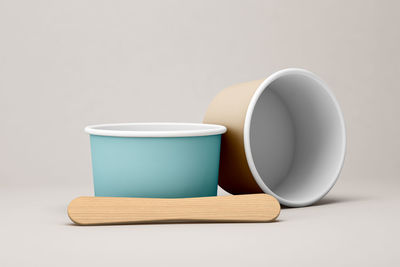 Close-up of tea cup on table against white background