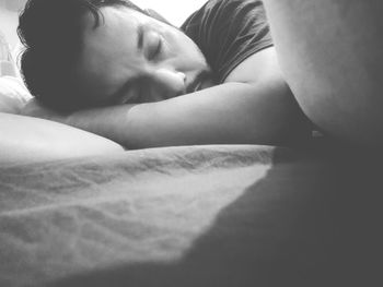 Close-up of baby sleeping on bed