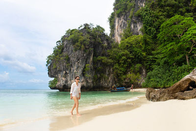 Full length of man on beach against sky