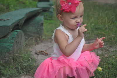 Woman holding pink flower