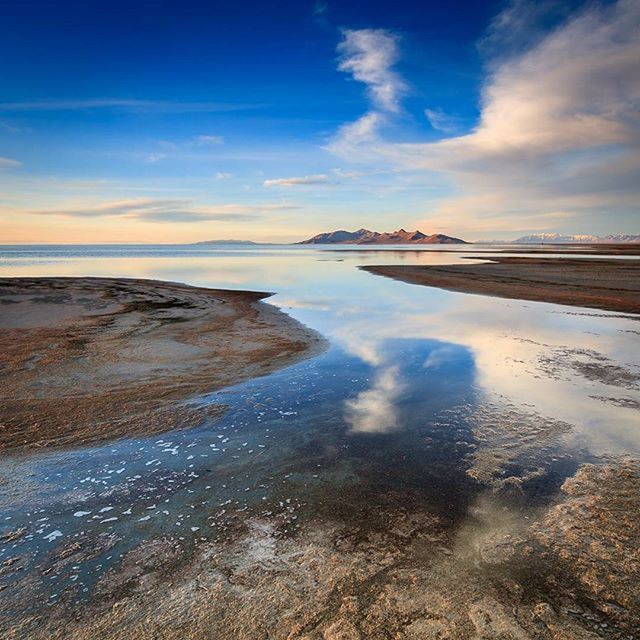 water, sea, beach, sky, tranquil scene, scenics, tranquility, beauty in nature, shore, horizon over water, cloud - sky, sand, nature, cloud, idyllic, blue, reflection, coastline, cloudy, calm