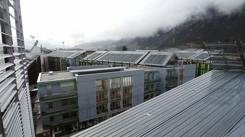 High angle view of solar panels on roof of buildings
