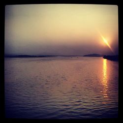 Scenic view of sea at sunset