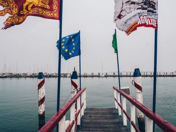 Pier over sea against sky