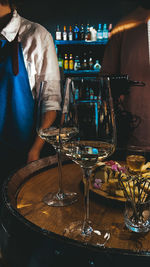 High angle view of wine glass on table at bar