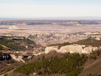 High angle view of landscape and sea against sky